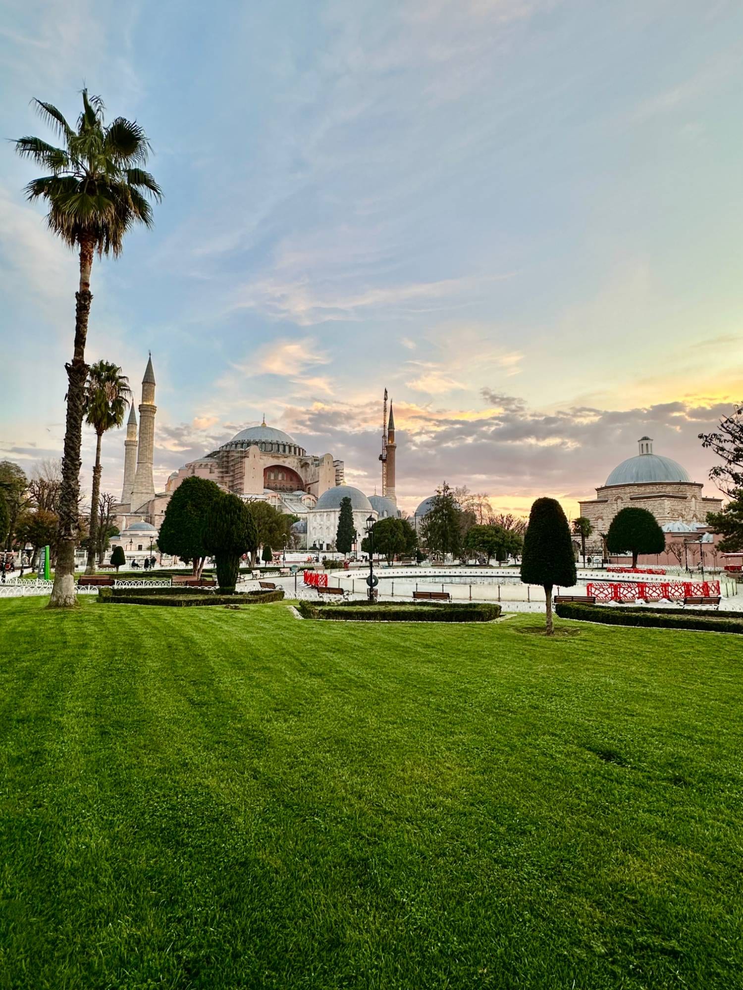 Hagia Sophia at sunset, its domes and minarets rising above the gardens of Sultanahmet in the Istanbul Old City